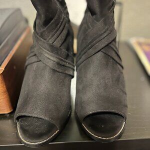 Black open-toe ankle booties.